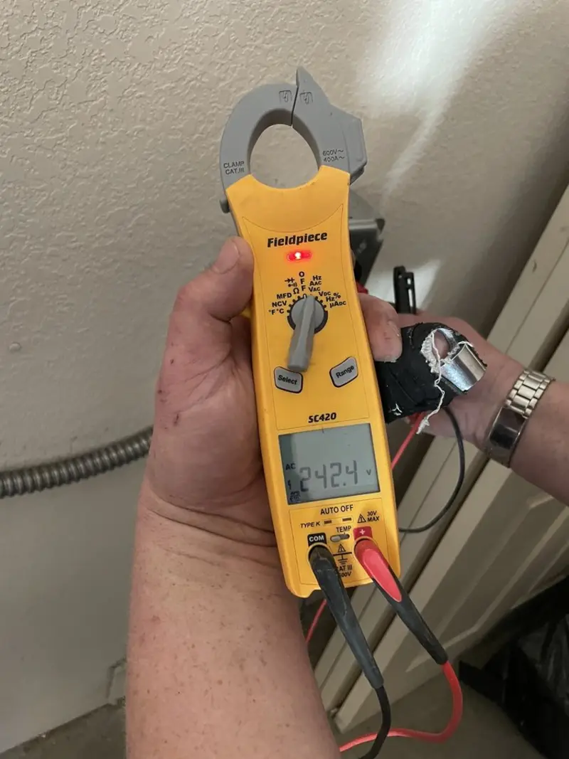 Voltage testing with clamp meter during Recessed Lighting Installation in Thibodaux